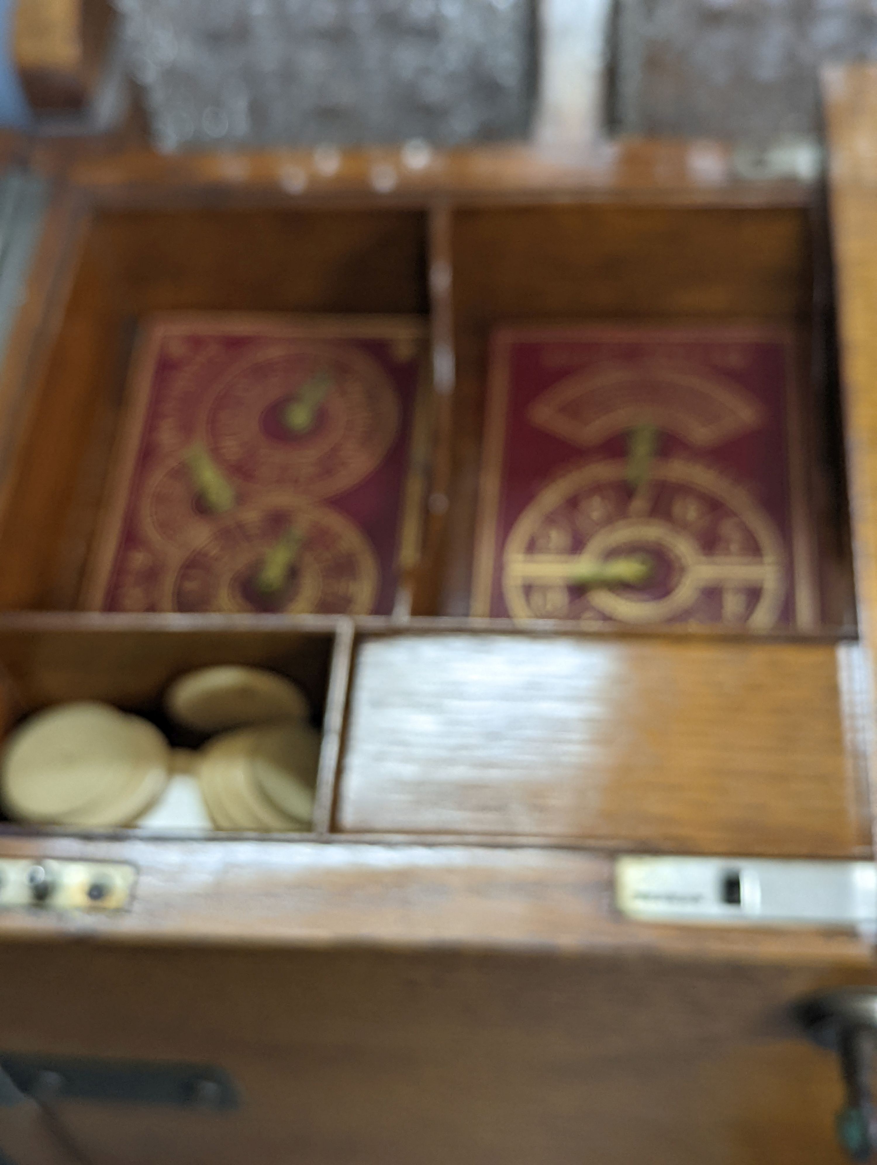 A Victorian brass mounted pale oak tantalus and combined games box, Height 37 cms.
